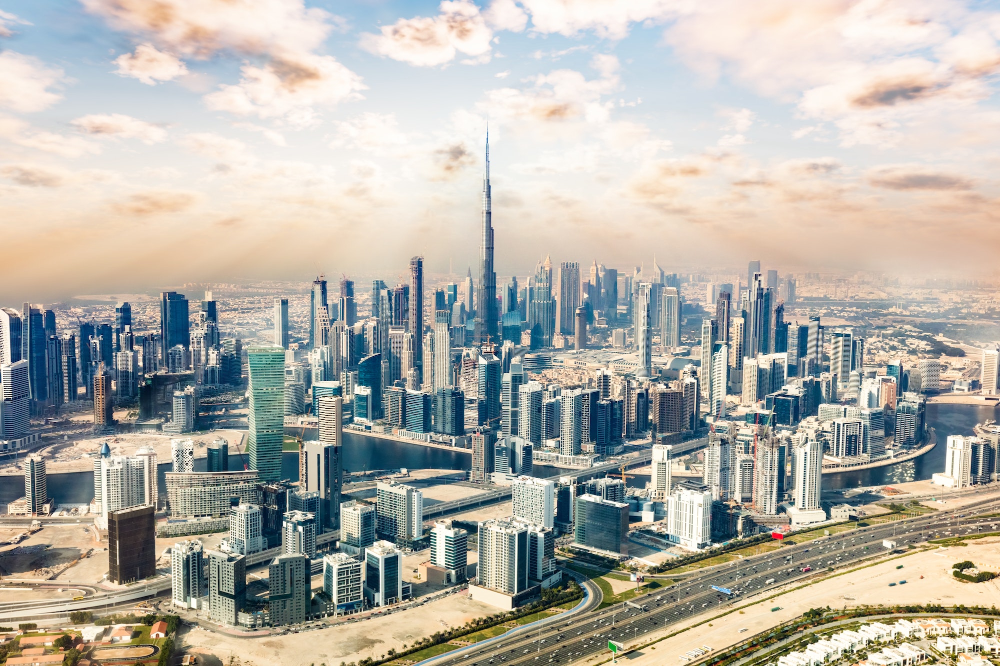 Dubai aerial view of downtown skyscrapers with Burj Khalifa at sunset