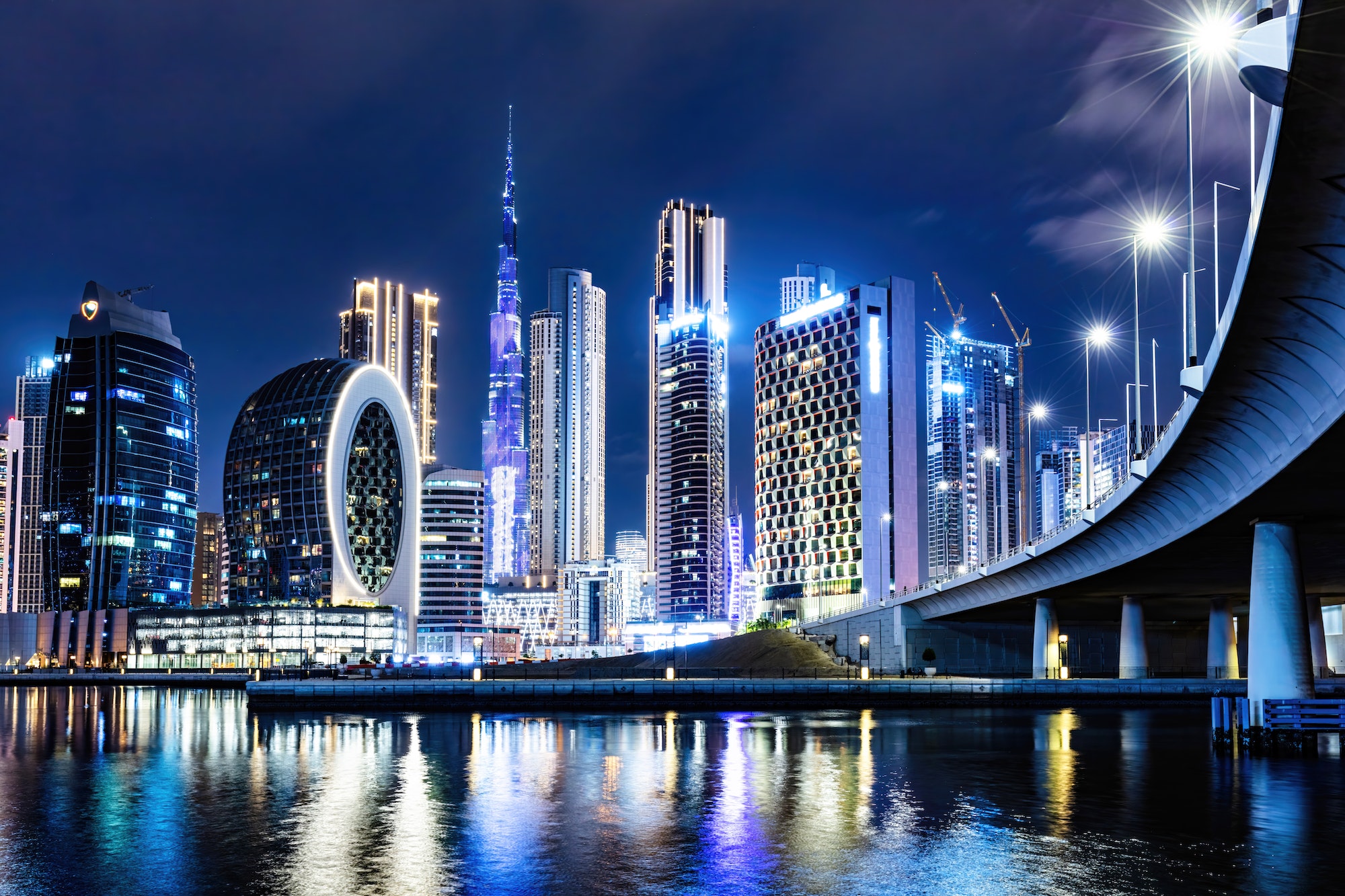 Skyscrapers skyline of Dubai UAE downtown with Burj Khalifa at night.