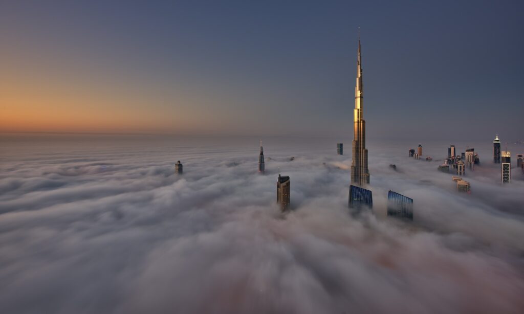 View of the Burj Khalifa and other skyscrapers above the clouds in Dubai, United Arab Emirates.